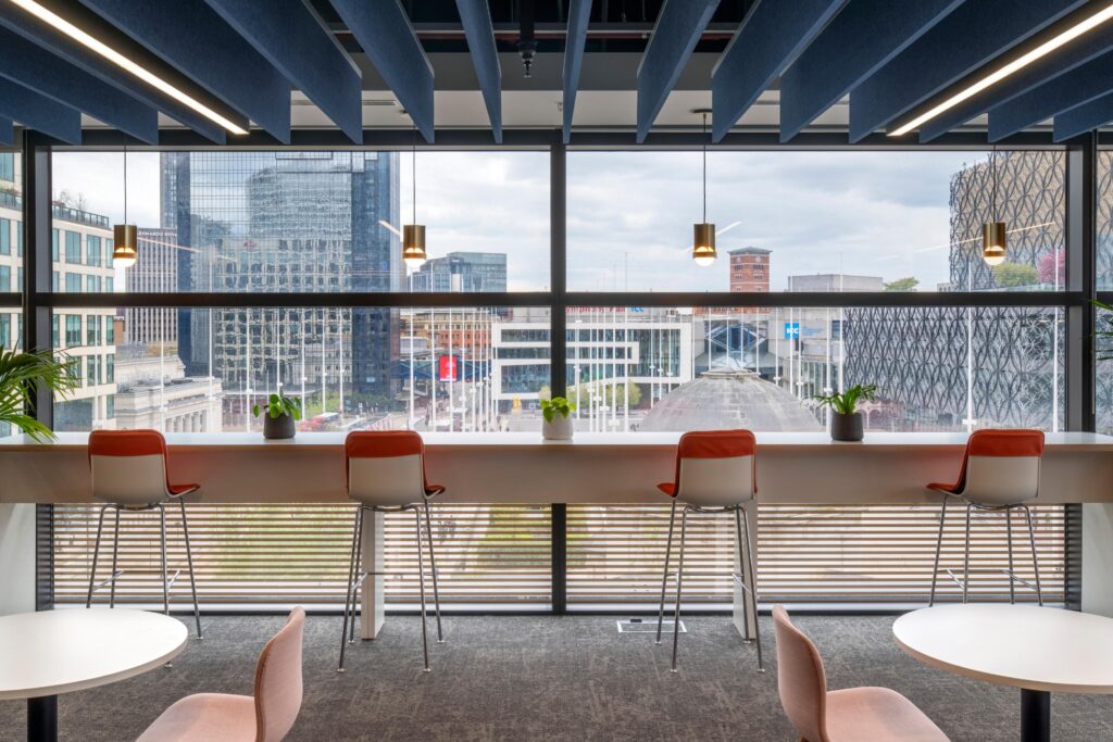 JLL's new office at One Centenary Way named one of region's best workplaces 10 10. JLL One Centenary Way counter seating with view JLL's new office at One Centenary Way named one of region's best workplaces